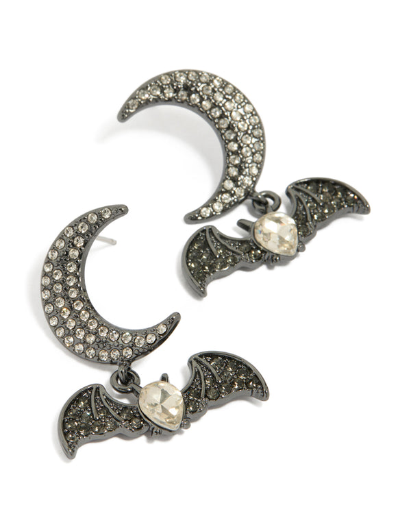 Showcasing bat and moon drop earrings with celestial features in silver front view