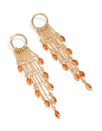 Showcasing gold ring with long amber diamante chain drop earrings featuring statement charm and tassel front view - link has visual effect only