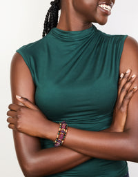 Featuring beads and balls in dark magenta, gold, green, and black, this chunky 3-pack of mixed stretch bracelets is shown on model view - link has visual effect only
