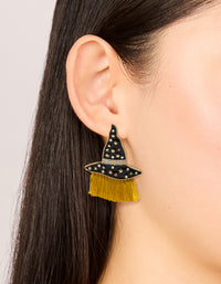 Stylish gold witch hat drop earrings with celestial star and tassel accents on ear view - link has visual effect only