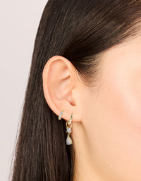 Beautifully designed waterproof gold plated stainless steel huggie drop earrings in a 2-pack with cubic zirconia and crystal accents on ear view - link has visual effect only