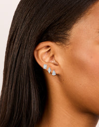 Featuring waterproof stainless steel classic stud earrings 3-pack with oval, marquise, and pear cut cubic zirconia in silver and clear on ear view - link has visual effect only