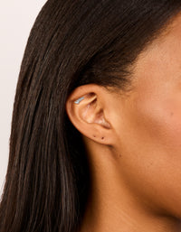 Featuring a crawler style single flat back stud earring crafted from surgical steel with cubic zirconia on ear view - link has visual effect only