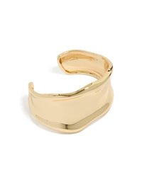 Discover a statement wavy wrist cuff crafted from plated metal in gold bangle front view - link has visual effect only