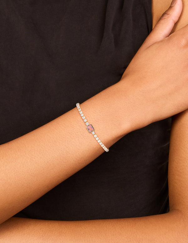 Featuring a gold plated pink cubic zirconia baguette tennis bracelet crafted from crystal on wrist view