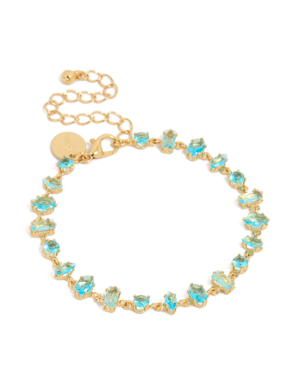 Showcasing a gold plated blue large multi cut cubic zirconia tennis bracelet with blue stones and statement design front view