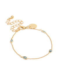Elegant gold plated bracelet featuring blue teardrop cubic zirconia with dainty chain and adjustable closure front view - link has visual effect only