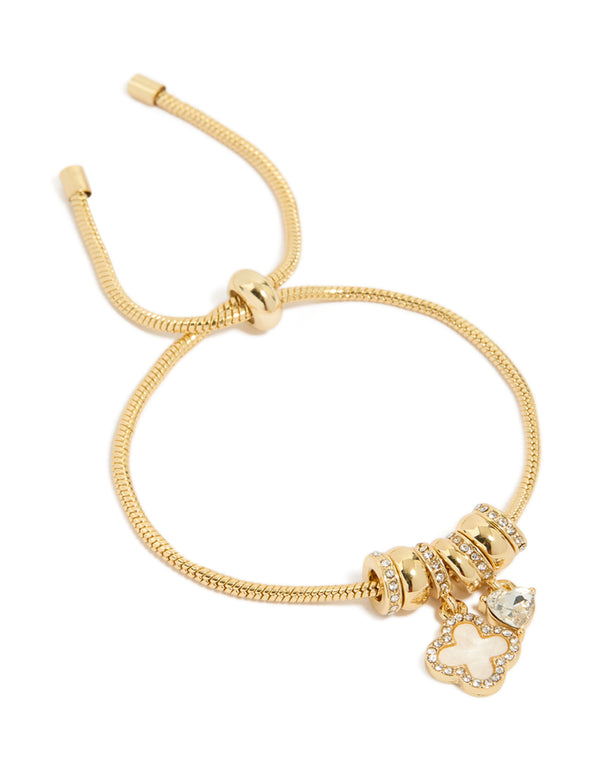 Showcasing a gold plated cubic zirconia flower and heart toggle bracelet with charm details front view
