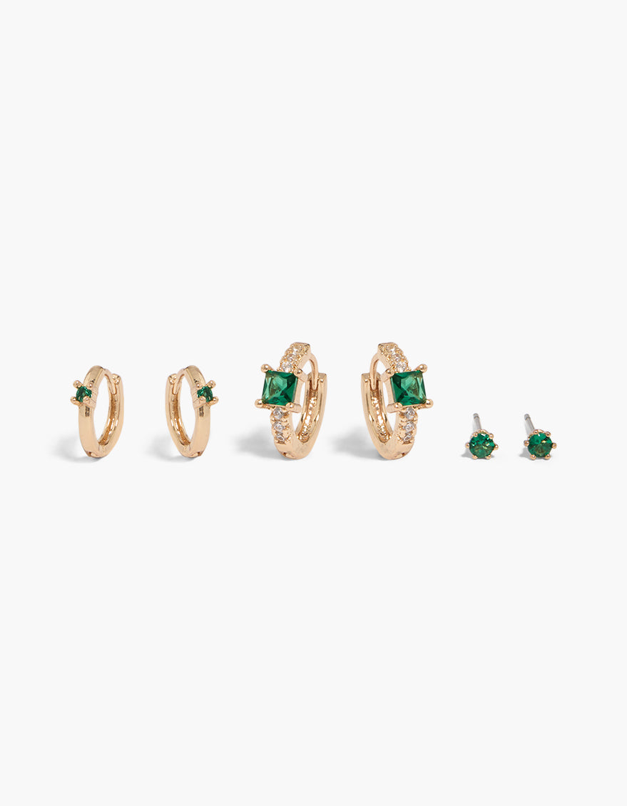 Dainty gold green cubic zirconia hoop and stud earrings in a 3-pack with crystal featuring huggie closure front view