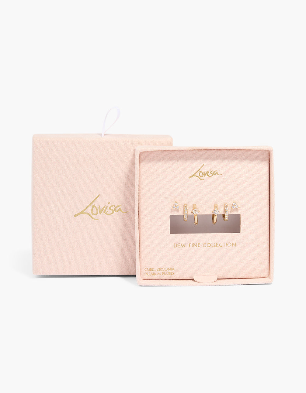 Showcasing gold plated cubic zirconia mini trio stud and huggie earrings in a 3-pack close up view