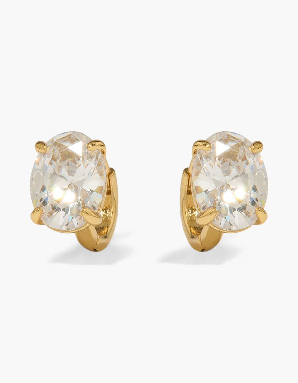 Showcasing gold plated cubic zirconia oval cut earrings with huggie closure front view