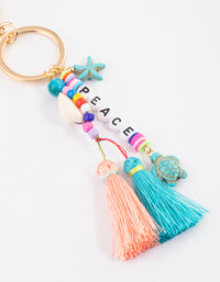 Gold Peace Tassel Key Ring - link has visual effect only